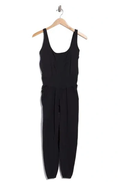 Free People Fp Movement Never Better Strappy Back Jumpsuit In Black