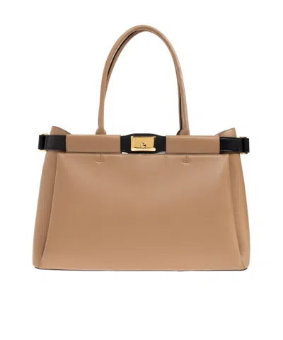 Furla Logo Engraved Top Handle Bag In Nude