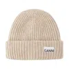 Ganni Wool-blend Light Structured Rib Knit Beanie In Beige