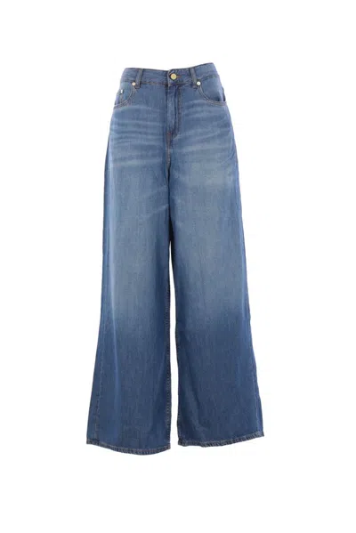 Ganni Logo Patch Whiskering Effect Jeans In Blue