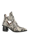 Ganni Snake Printed Chunky Buckle Open Cut Boots In Beige