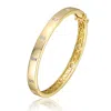 Genevive Jewelry Women's Gold Plated Bezel Set With Clear Cubic Zirconia Bangle Bracelet In Gold