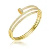 Genevive Jewelry Women's Gold / White Rachel Glauber Gold Plated Cubic Zirconia Bangle Bracelet In Multi