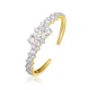 Genevive Jewelry Women's Sterling Silver Gold Plated Cubic Zirconia Bypass Bangle Bracelet In Gold