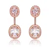 Genevive Jewelry Women's White / Rose Gold Cz Rose Plated Sterling Silver Oval Ear Puff Earrings In Multi