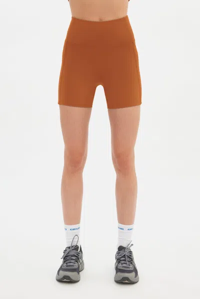 Girlfriend Collective Caramel Compressive Pocket Run Short In Brown
