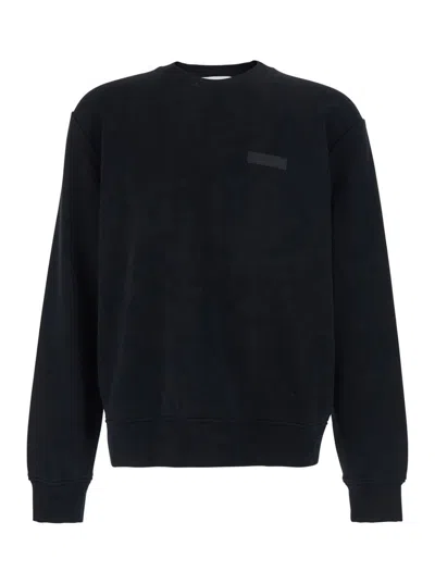 GIVENCHY BLACK CREWNECK SWEATSHIRT WITH LOGO PATCH ON THE FRONT IN COTTON MAN