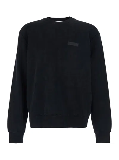 GIVENCHY BLACK CREWNECK SWEATSHIRT WITH LOGO PATCH ON THE FRONT IN COTTON MAN
