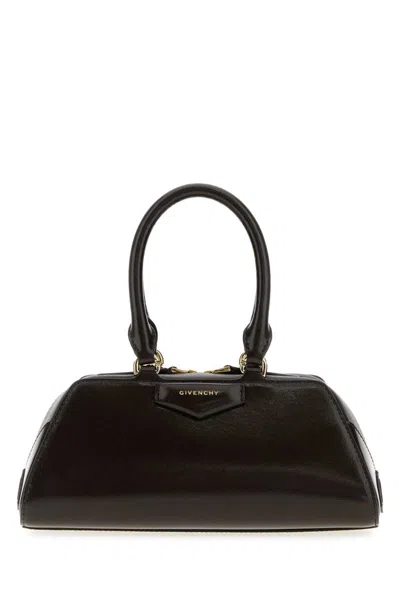 Givenchy Handbags. In Brown