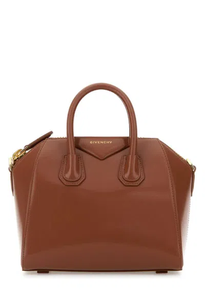 Givenchy Handbags. In Brown