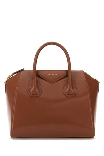Givenchy Handbags. In Brown