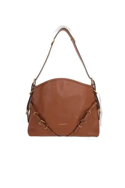 Givenchy Handbags. In Brown