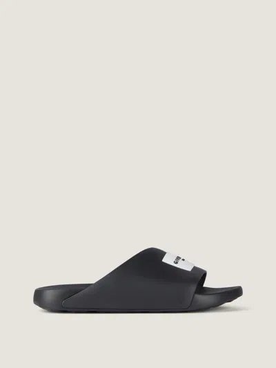 Givenchy Label Slide Flat Mules In Rubber In Black