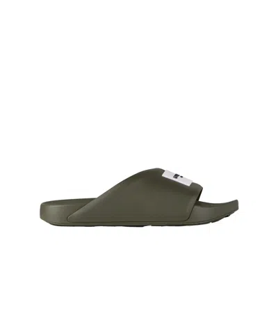 Givenchy Label Slide Flat Mules In Rubber In Green