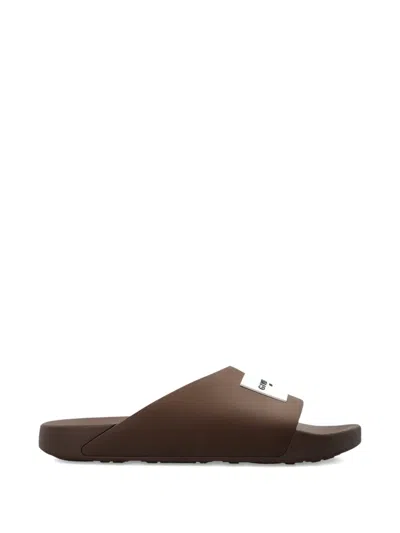 Givenchy Label Slide Flat Mules In Rubber In Brown