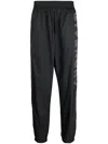 Givenchy Relaxed Fit Logo Embroidered Track Pants In Gray