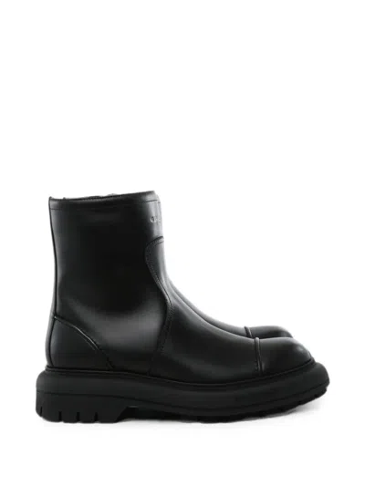Givenchy Logo-embossed Leather Boots In Black
