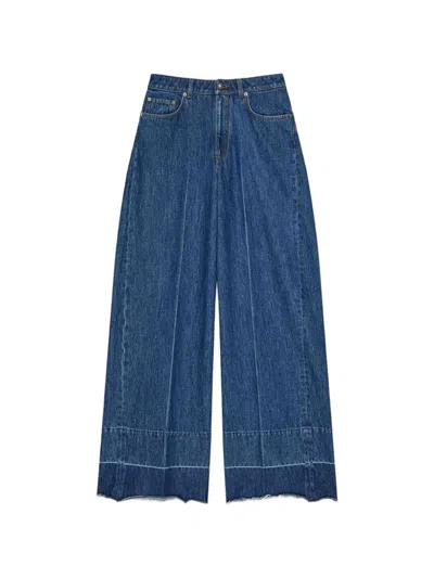Givenchy Raw Edge Wide Leg Denim Trousers In Blue