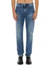 Givenchy Washed Denim Tapered Leg Jeans With Contrast Stitching In Denim
