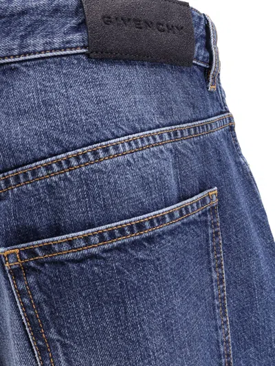 Givenchy Twisted Stone-washed Denim Jeans In Blue