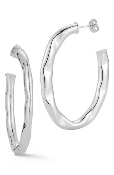 Glaze Jewelry Wavy Oval Hoop Earrings In Metallic