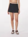 Glyder Socialite Mini Skirt In Black/oatmilk-almond Contrast In Animal Print