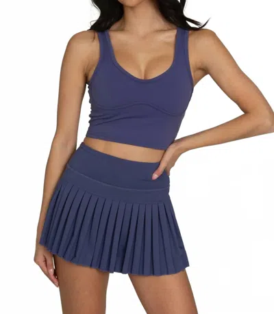 Gold Hinge Pleated Tennis Skirt In True Navy In Blue