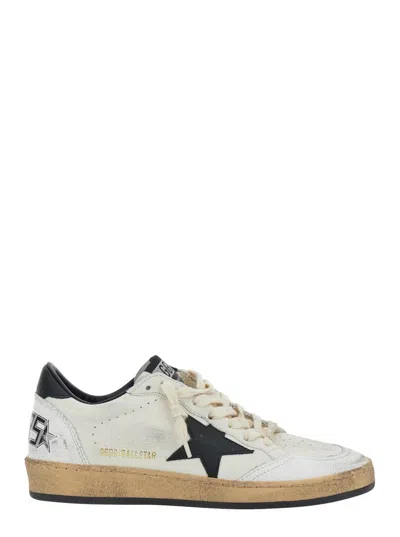 GOLDEN GOOSE BALLSTAR' BLACK AND WHITE LOW TOP SNEAKERS WITH STAR PATCH ON THE SIDE AND CONTRASTING HEEL WITH WRI