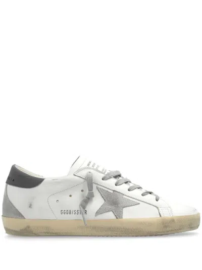 GOLDEN GOOSE GOLDEN GOOSE CALF LEATHER SNEAKERS WITH DISTRESSED FINISH AND SIGNATURE STAR PATCH