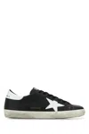 Golden Goose 'super-star' Black Low Top Sneakers With Logo Patch And Suede Details In Leather Man In Black