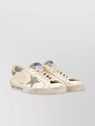 GOLDEN GOOSE LEATHER SNEAKERS WITH ICONIC STAR AND BREATHABLE HOLES