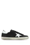 Golden Goose 'super-star' Black Low Top Sneakers With Logo Patch And Suede Details In Leather Man In Black