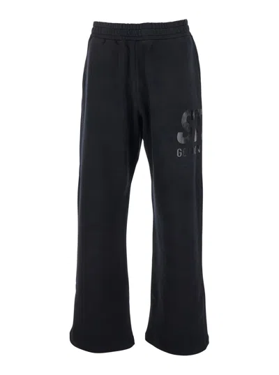 GOLDEN GOOSE GOLDEN GOOSE MEN BLACK JOGGER PANTS WITH LOGO PRINTED ON THE SIDE IN COTTON MAN