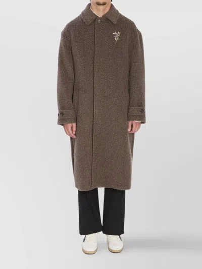 GOLDEN GOOSE TRAVEL COAT WITH FLORAL PIN AND BACK VENT