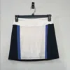 Golftini Women's Stability Short Skort In White/black/blue In Multi