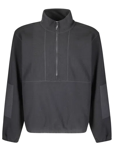 Gr10k High Collar Half-zip Fleece Pullover With Zippered Pockets In Black