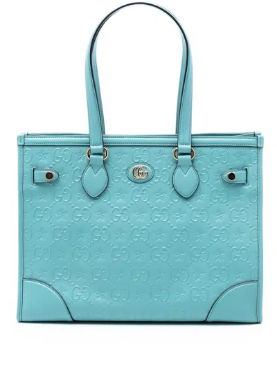 Pre-owned Gucci 2016-2025 Gg Star Embossed Leather Tote Bag In Blue