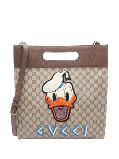 Pre-owned Gucci 2016-2025 Gg Supreme Donald Duck Neo Vintage Soft Tote Satchel In Brown