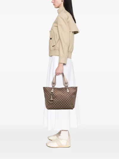 Pre-owned Gucci 2016-2025 Medium Gg Canvas Icon Bit Tote Bag In Brown