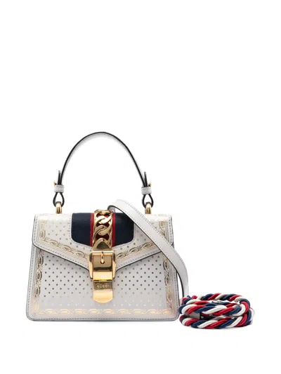 Pre-owned Gucci 2016-2026 Mini Calfskin Web Star Print Sylvie Satchel In Gold