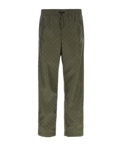 Gucci All-over Logo-print Trousers In Green