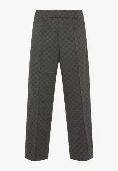 GUCCI ALL-OVER LOGO TRACK PANTS