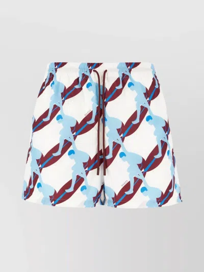 GUCCI ALL-OVER PRINT SWIM SHORTS