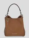 Gucci Gg Emblem Leather Bucket Bag With Frontal Logo In Brown