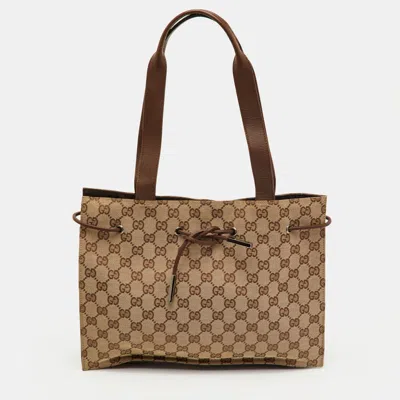 Pre-owned Gucci Beige/brown Gg Canvas And Leather Drawstring Tote In Sand
