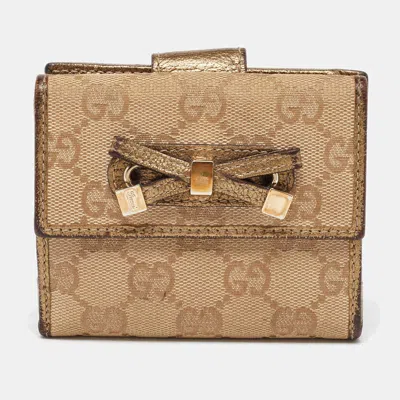 Pre-owned Gucci Beige/gold Gg Canvas And Leather Compact Wallet