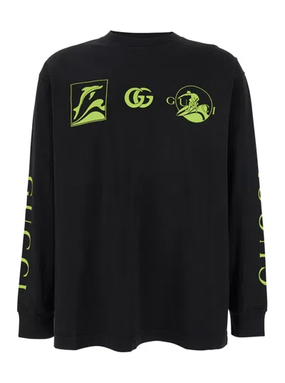 GUCCI BLACK CREWNECK T-SHIRT WITH ALL-OVER PRINTS AND MAXI LOGO LETTERING ON THE SLEEVES IN COTTON MAN