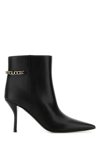 Gucci Signoria Leather Chain Ankle Booties In Black