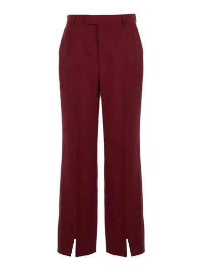 GUCCI GUCCI WOMEN BORDEAUX TAILORED PANTS WITH SLITS ON THE EDGES AND EMBROIDERED LETTERING LOGO ON THE BA