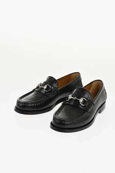 Gucci Brushed Leather Loafers With Monogram Embossed Detail In Black